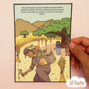 Hand holding a Bible craft based on Ruth and Boaz